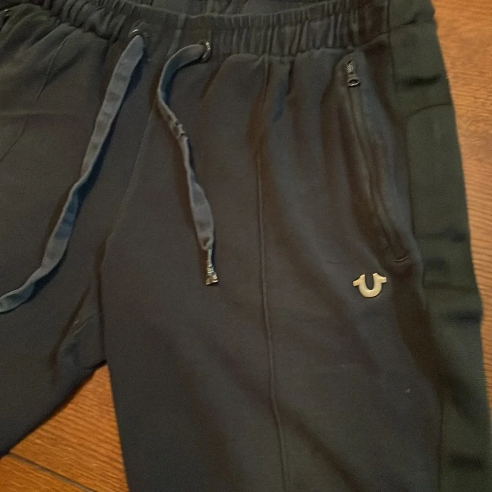 True Religion knit shorts. Large. Black. Metal logo. Some wear
